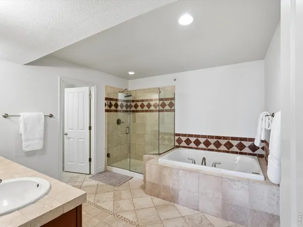 a bathroom with a bathtub and a shower