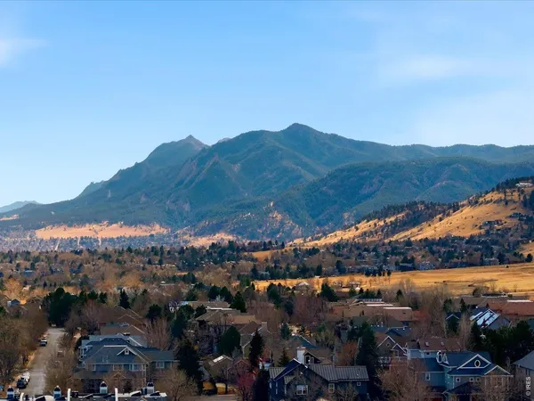 a view of a city with mountains