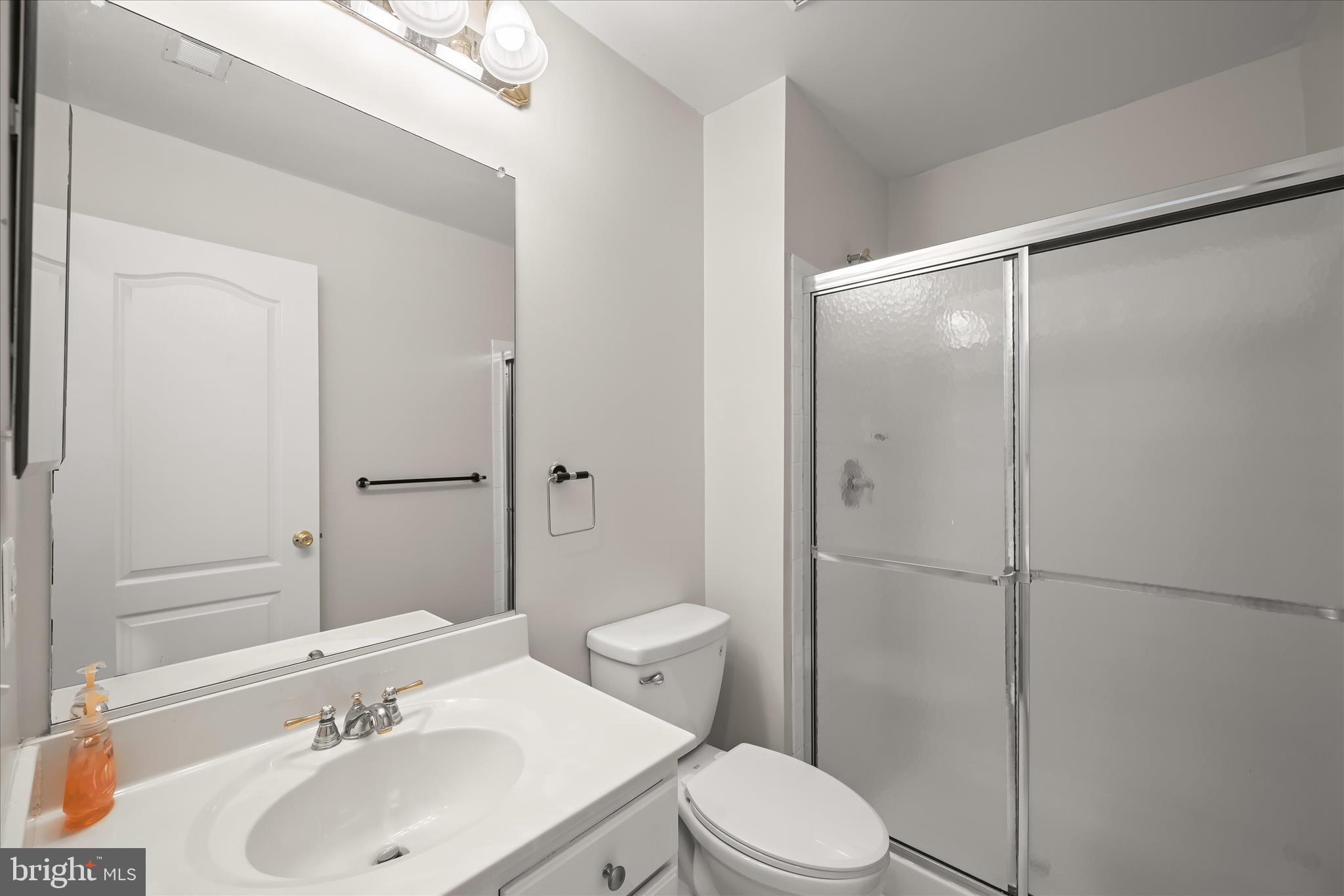 2311 Abby Road Edgewater, MD 21037 - Photo 30 of 46 a bathroom with a sink toilet and shower
