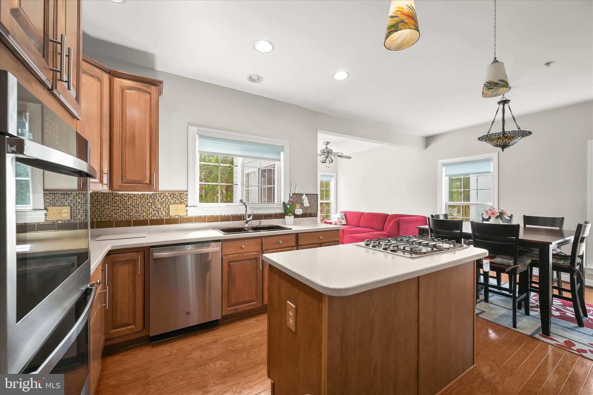 2311 Abby Road Edgewater, MD 21037 - Photo 5 of 46 a kitchen that has a lot of cabinets a sink and a stove in it