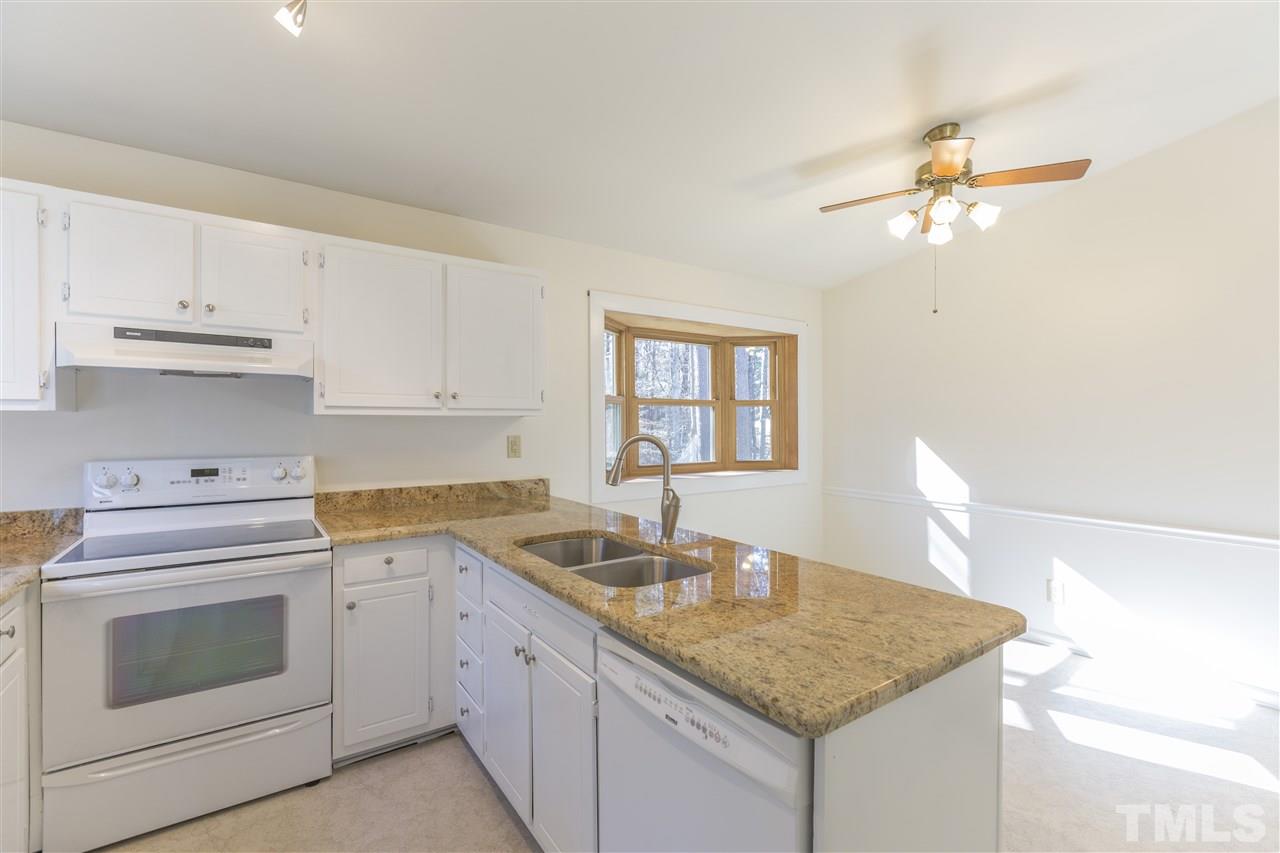 6000 Ballou Court Raleigh, NC 27609 - Photo 9 of 24 Granite counters and refurbished cabinets with new hinges and pulls.