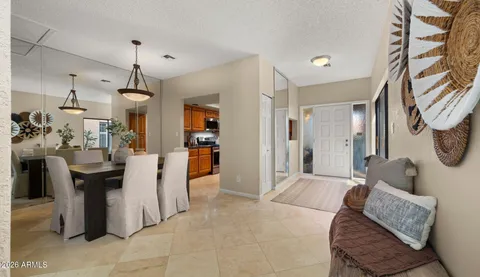 a view of a livingroom with furniture & cabinets