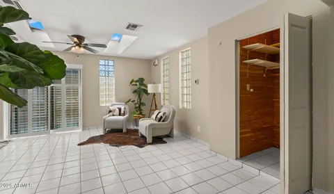 a utility room with a stove and a tub