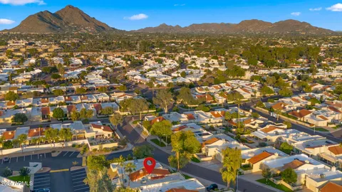 an aerial view of residential houses and city street