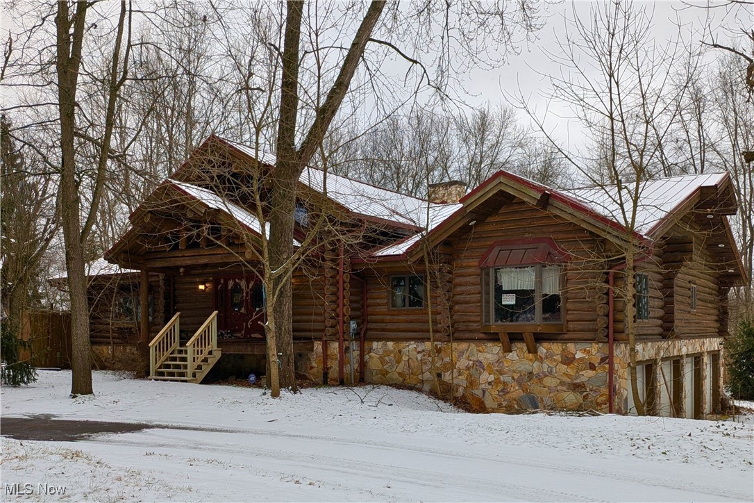 8026 Lee Road Northwest Malvern, OH 44644 - Photo 2 of 44 Log cabin with log siding and a chimney