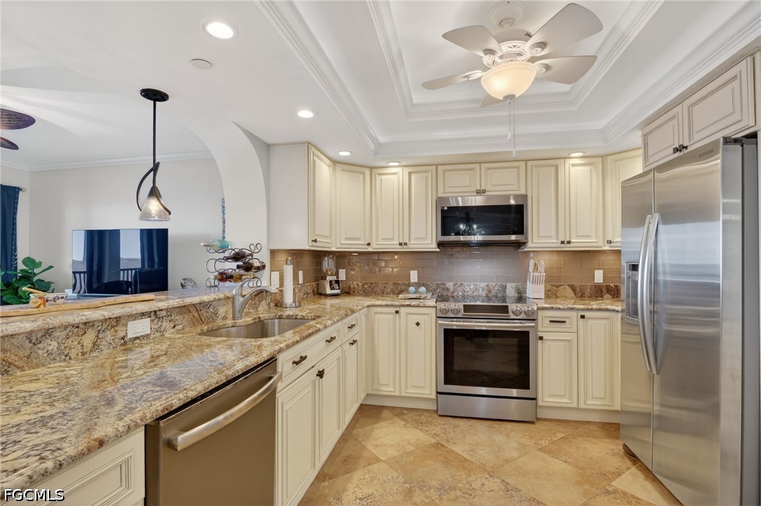 1900 Virginia Avenue, Unit 802 Fort Myers, FL 33901 - Photo 13 of 33 a kitchen with stainless steel appliances granite countertop a stove sink microwave and refrigerator