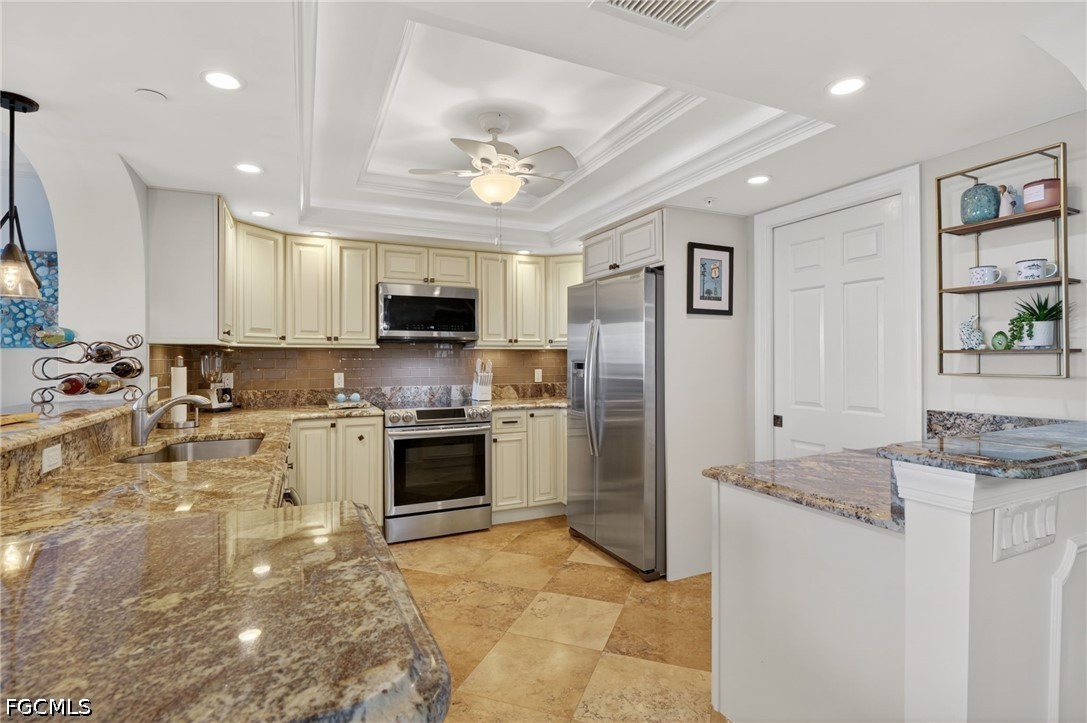 1900 Virginia Avenue, Unit 802 Fort Myers, FL 33901 - Photo 15 of 33 a kitchen with stainless steel appliances granite countertop a stove refrigerator and a sink