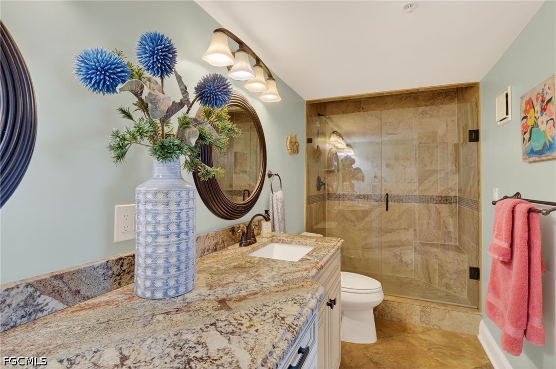 1900 Virginia Avenue, Unit 802 Fort Myers, FL 33901 - Photo 19 of 33 a bathroom with a sink toilet and shower