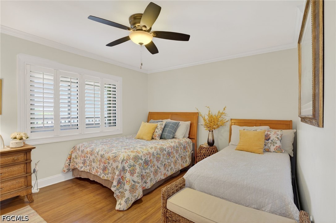 1900 Virginia Avenue, Unit 802 Fort Myers, FL 33901 - Photo 22 of 33 a bedroom with two beds and painting on the wall