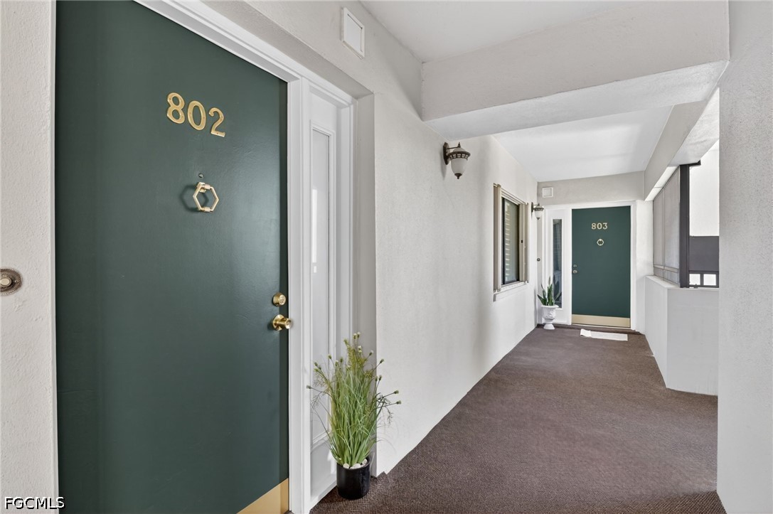 1900 Virginia Avenue, Unit 802 Fort Myers, FL 33901 - Photo 3 of 33 a view of a hallway with entryway