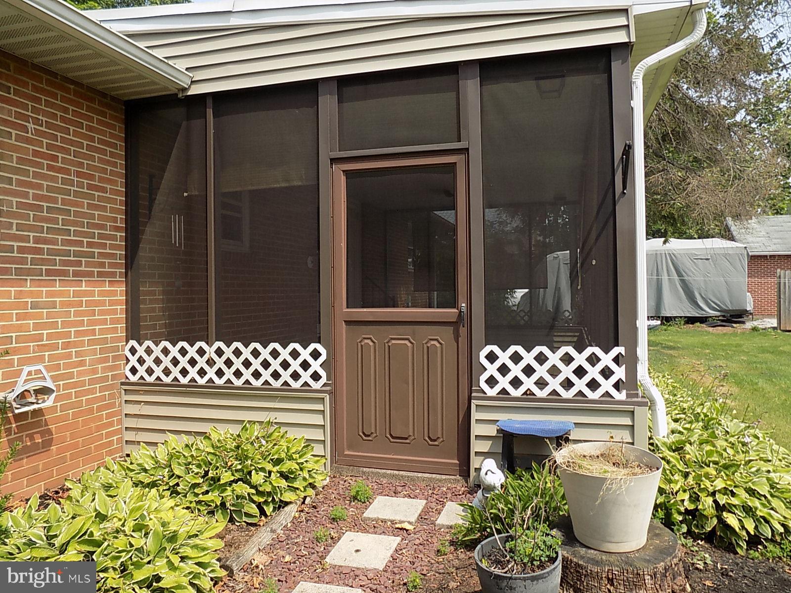 2017 Derry Road York, PA 17408 - Photo 6 of 55 Rear of property at screened in porch.