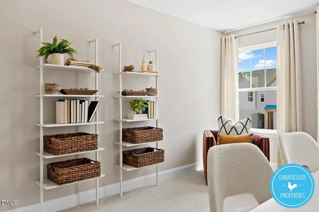 a room with furniture a rug and a window