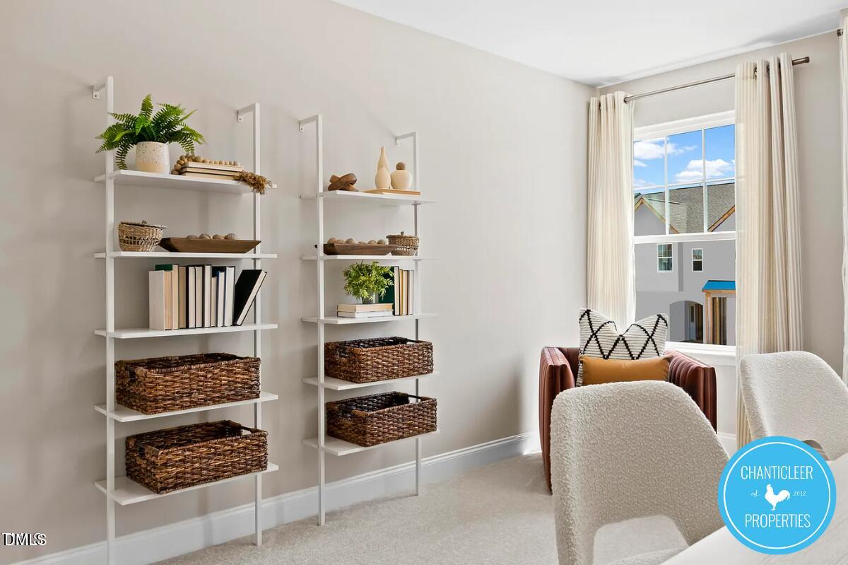 24 Hyacinth Lane, Unit 99 Angier, NC 27501 - Photo 4 of 9 a room with furniture a rug and a window