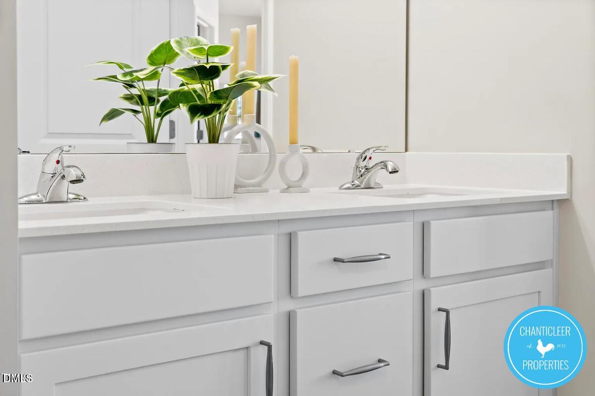 24 Hyacinth Lane, Unit 99 Angier, NC 27501 - Photo 7 of 9 a bathroom sink with a granite countertop toilet