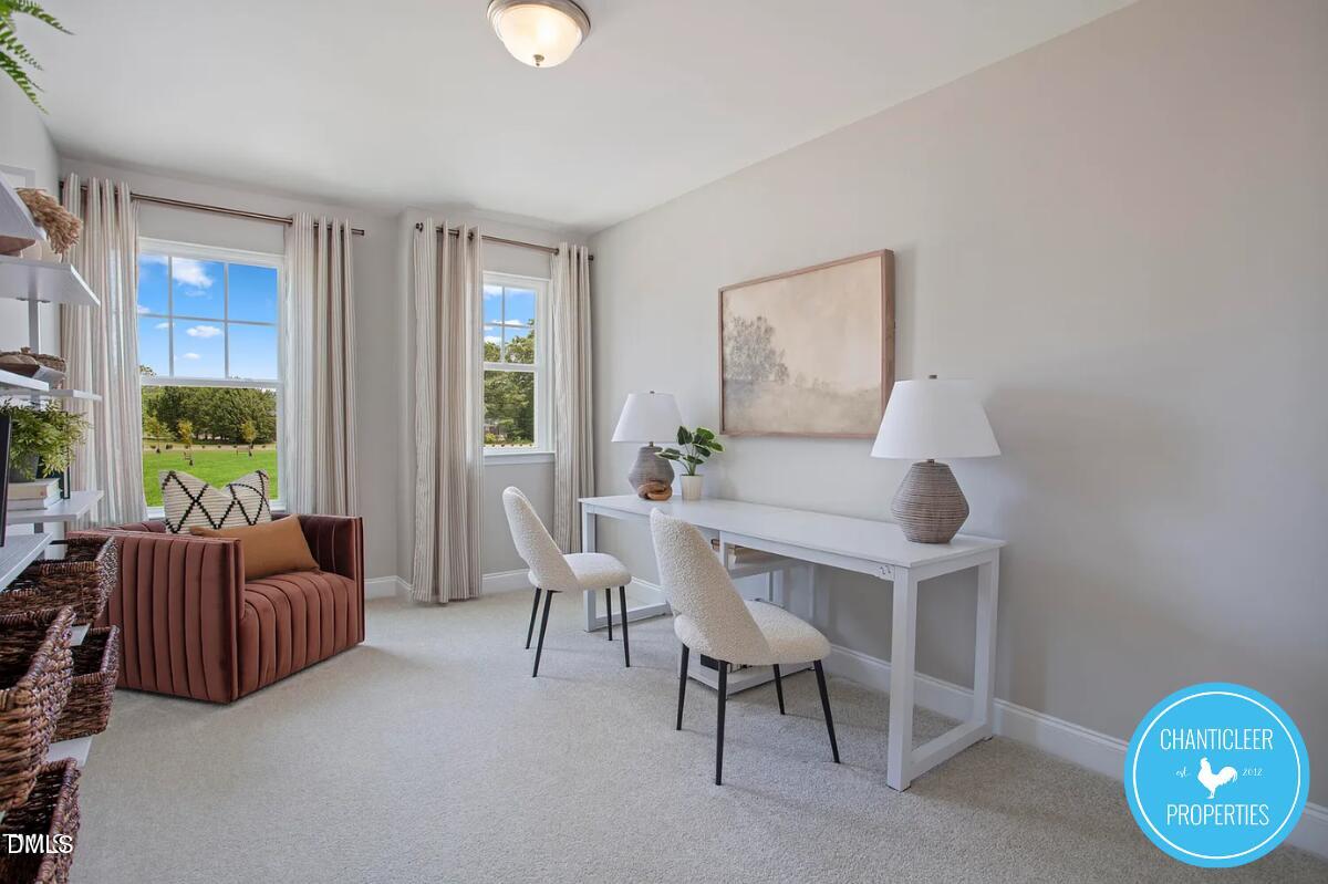 24 Hyacinth Lane, Unit 99 Angier, NC 27501 - Photo 9 of 9 a living room with furniture and a window