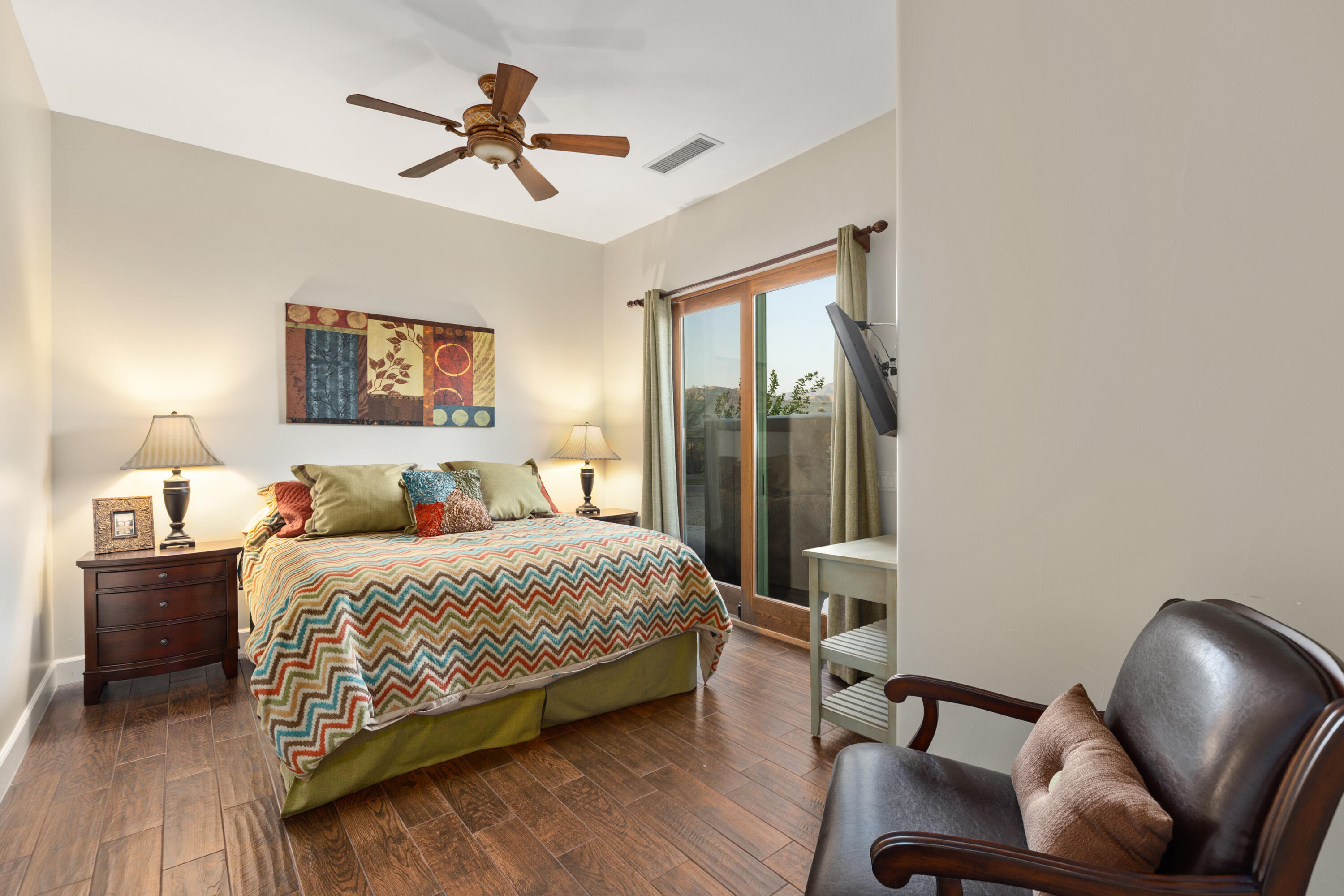 83005 North Shore Drive Indio, CA 92203 - Photo 13 of 40 a bedroom with a bed and a chair