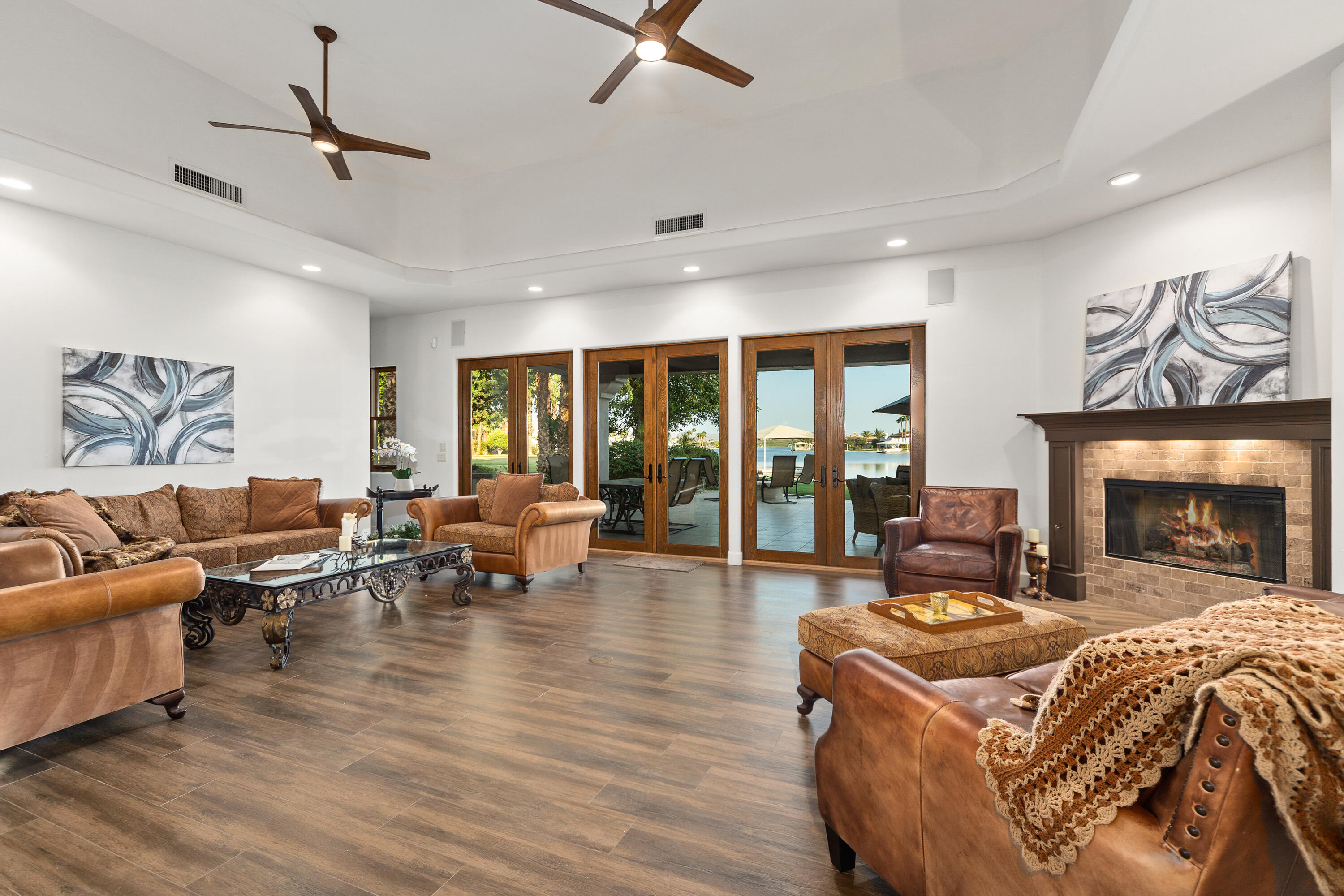 83005 North Shore Drive Indio, CA 92203 - Photo 17 of 40 a living room with furniture gym equipment and a fireplace