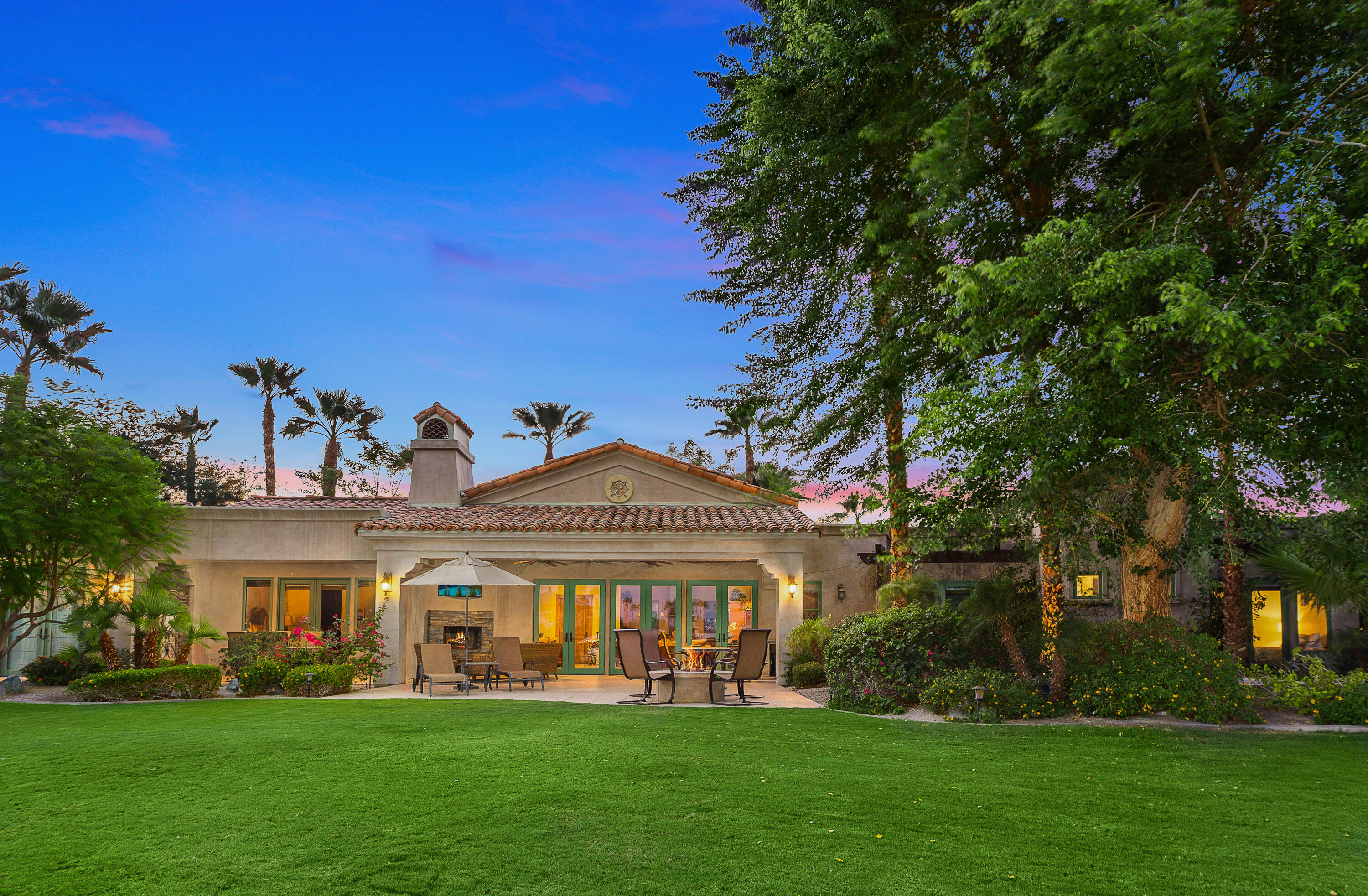 83005 North Shore Drive Indio, CA 92203 - Photo 19 of 40 a front view of a building with a garden