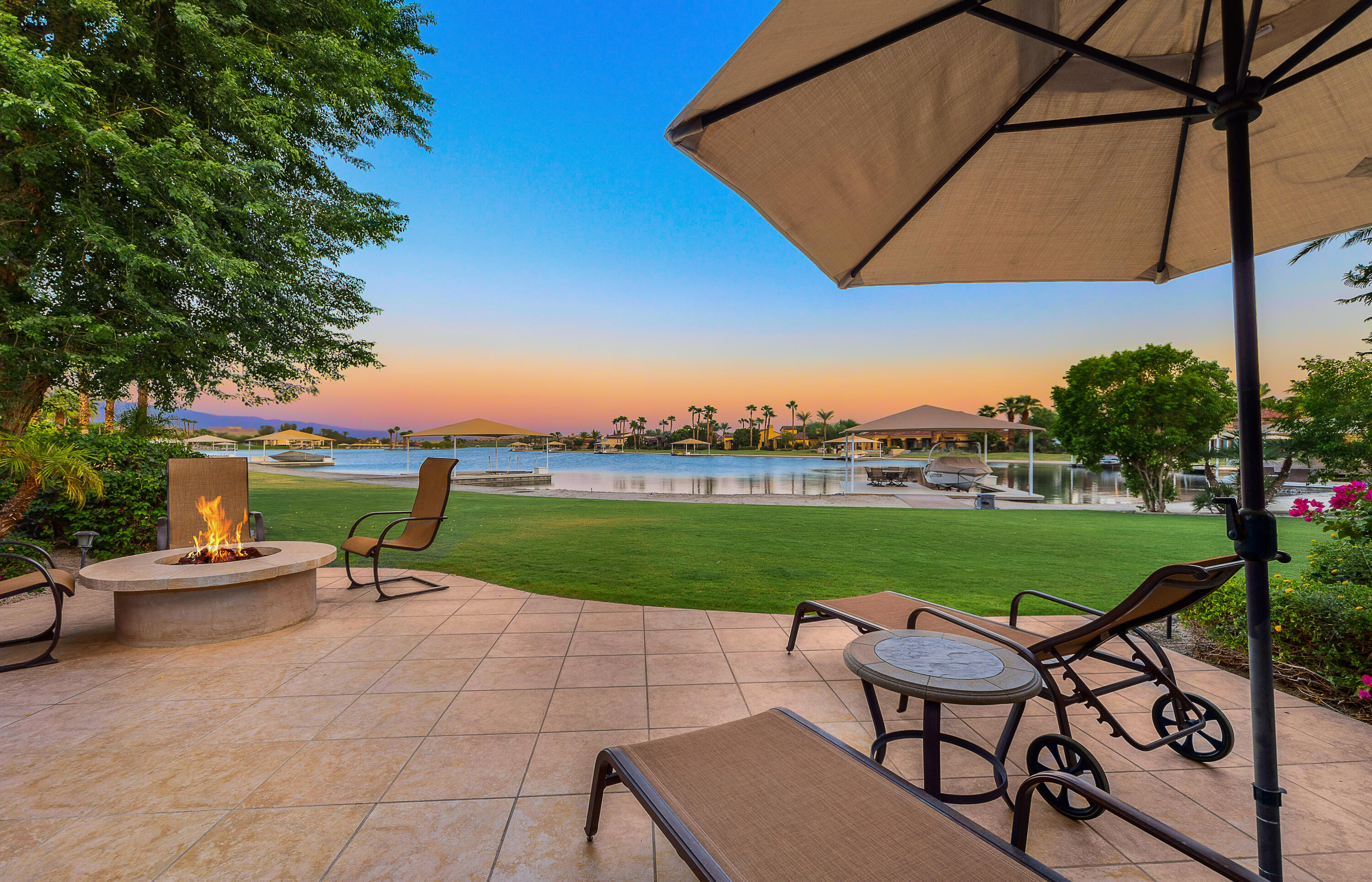 83005 North Shore Drive Indio, CA 92203 - Photo 24 of 40 an outdoor sitting area with furniture and garden