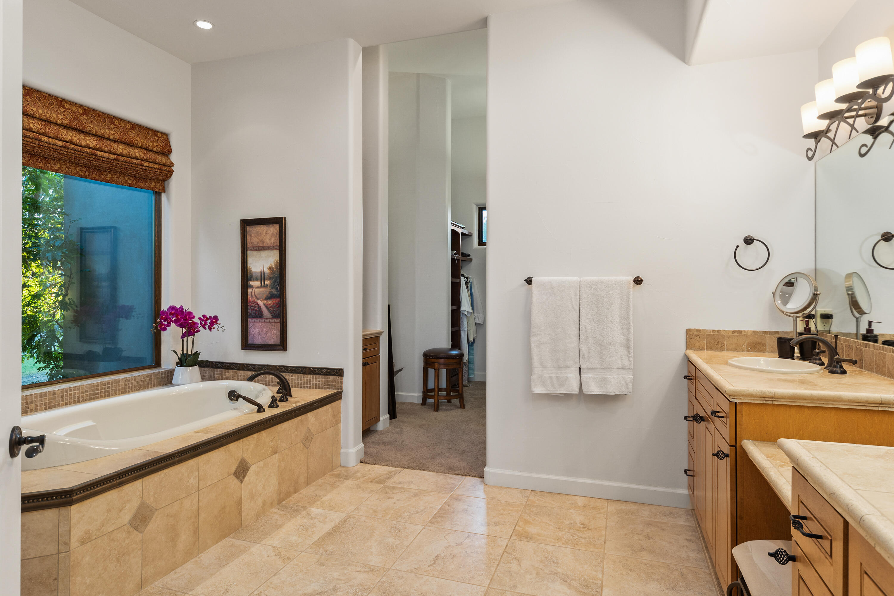 83005 North Shore Drive Indio, CA 92203 - Photo 28 of 40 a bathroom with a tub sink and mirror