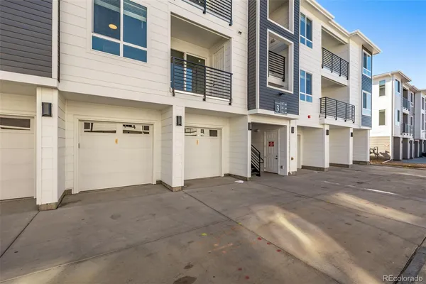 a view of a building with a parking space
