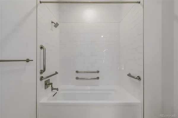a bathroom with a bathtub and a toilet