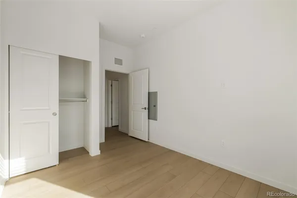 a bathroom with a sink toilet vanity and shower