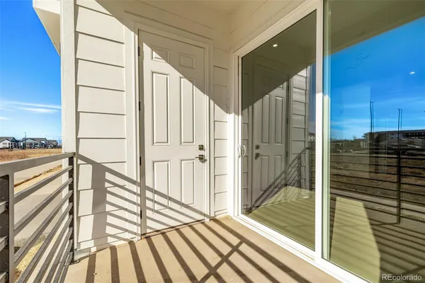 a view of swimming pool with outdoor seating and a garden