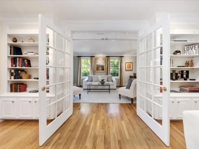 a view of living room with furniture and wooden floor