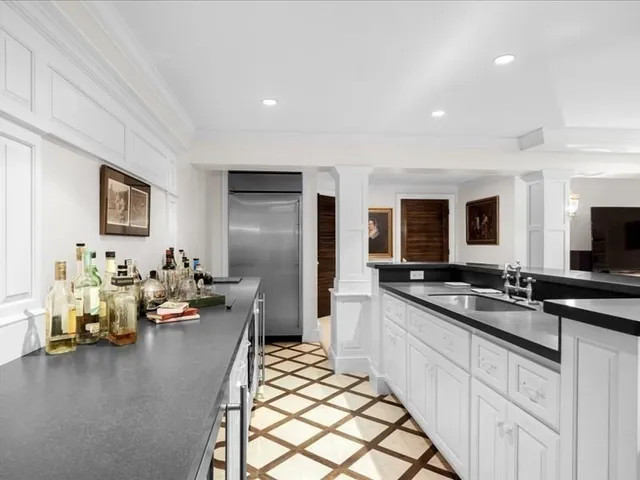 a large room with a large window and furniture