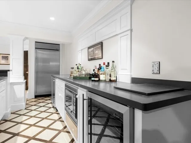 a kitchen with stainless steel appliances granite countertop a sink and cabinets