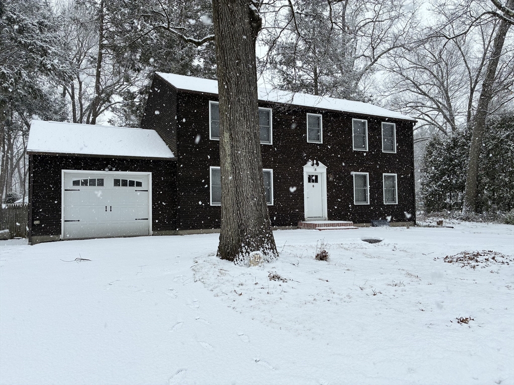 a view of a house with snow in the yard