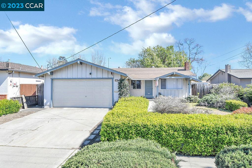3584 Thunderbird Drive Concord, CA 94520 - Photo 1 of 1 a front view of a house with a yard and garage