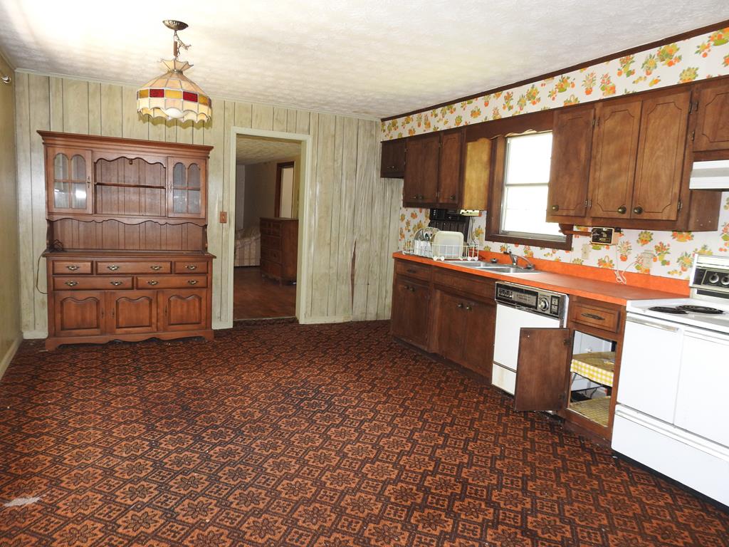 333 Lickskillet Road Epworth, GA 30541 - Photo 26 of 32 a kitchen with stainless steel appliances a sink and cabinets