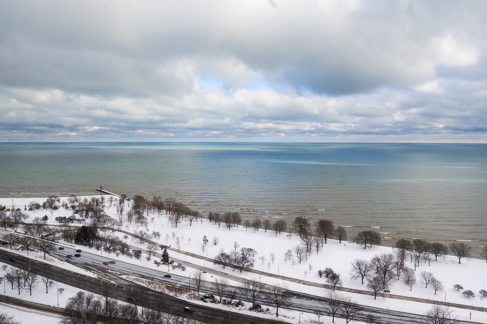 5445 North Sheridan Road, Unit 3210 Chicago, IL 60640 - Photo 3 of 14 a view of a lake with a city