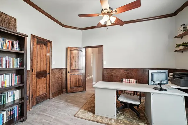 a view of a room with workspace and a window