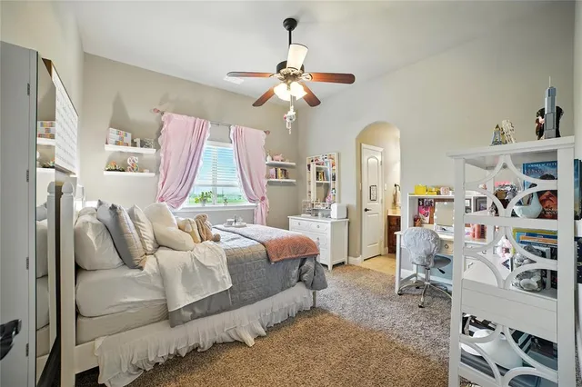 a bedroom with furniture a bed and a window