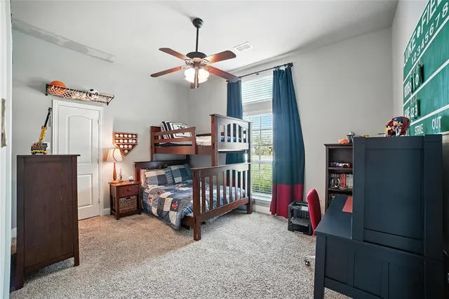 a bedroom with furniture and a chandelier