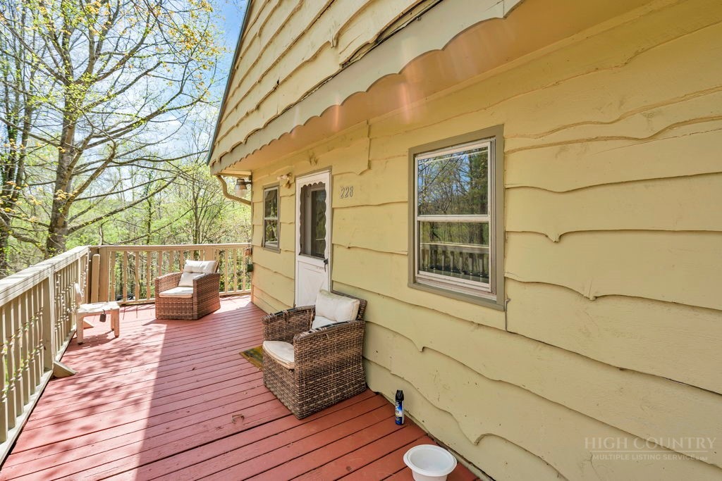 179 Soave Ridge Deep Gap, NC 28618 - Photo 6 of 31 a view of deck with table and chairs