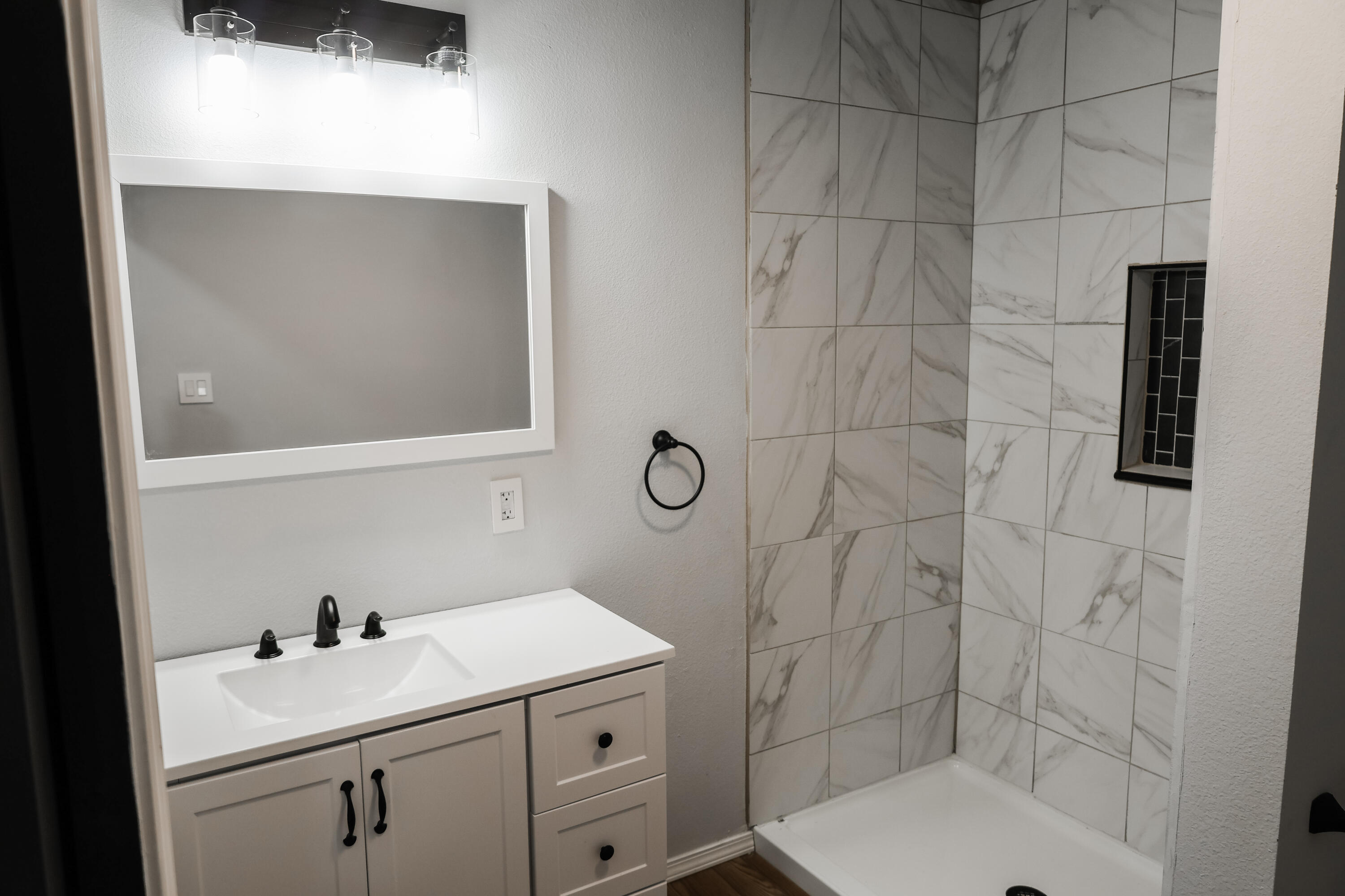 112 Southwest 8th Plainview, TX 79072 - Photo 15 of 24 a bathroom with a sink toilet and shower