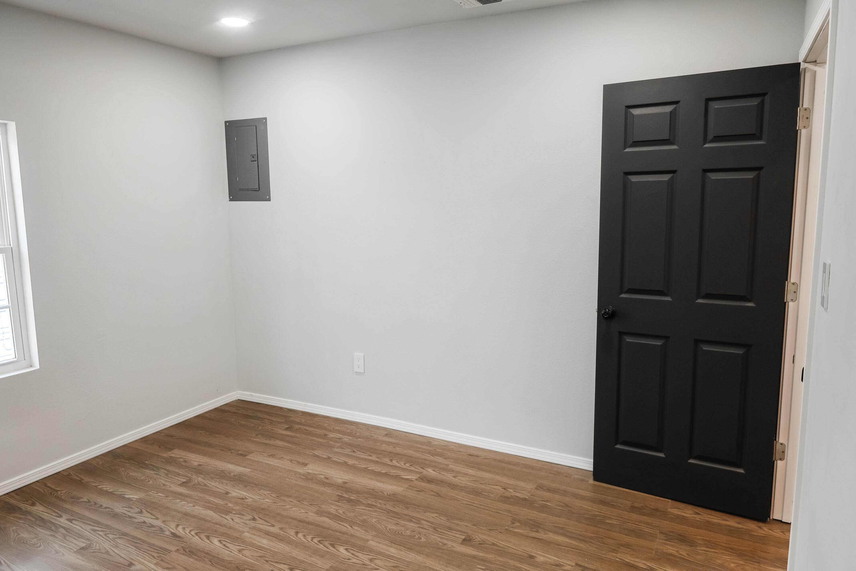 112 Southwest 8th Plainview, TX 79072 - Photo 17 of 24 an empty room with wooden floor and closet