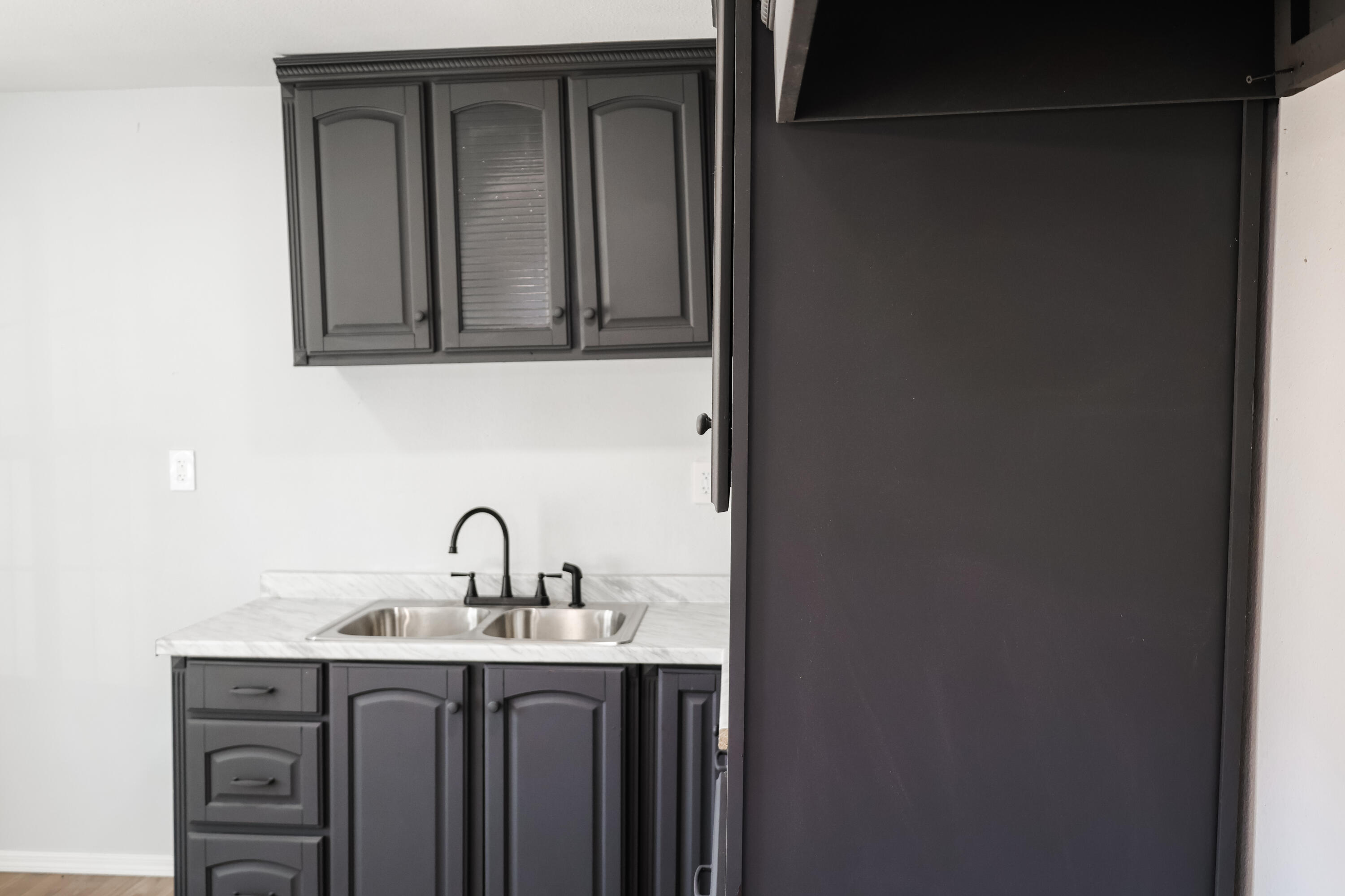 112 Southwest 8th Plainview, TX 79072 - Photo 8 of 24 a bathroom with a sink and a mirror