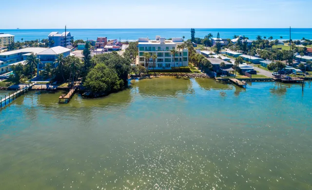 a view of a house with a flower garden