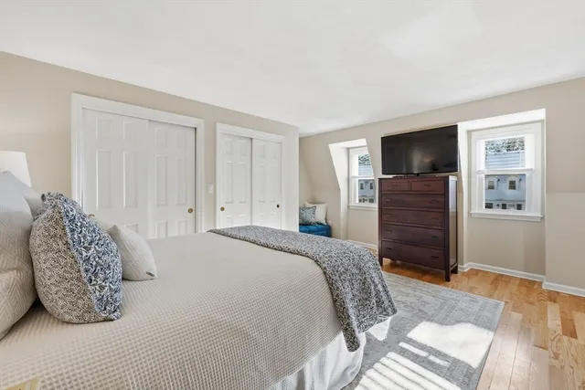 a bedroom with a bed and a television