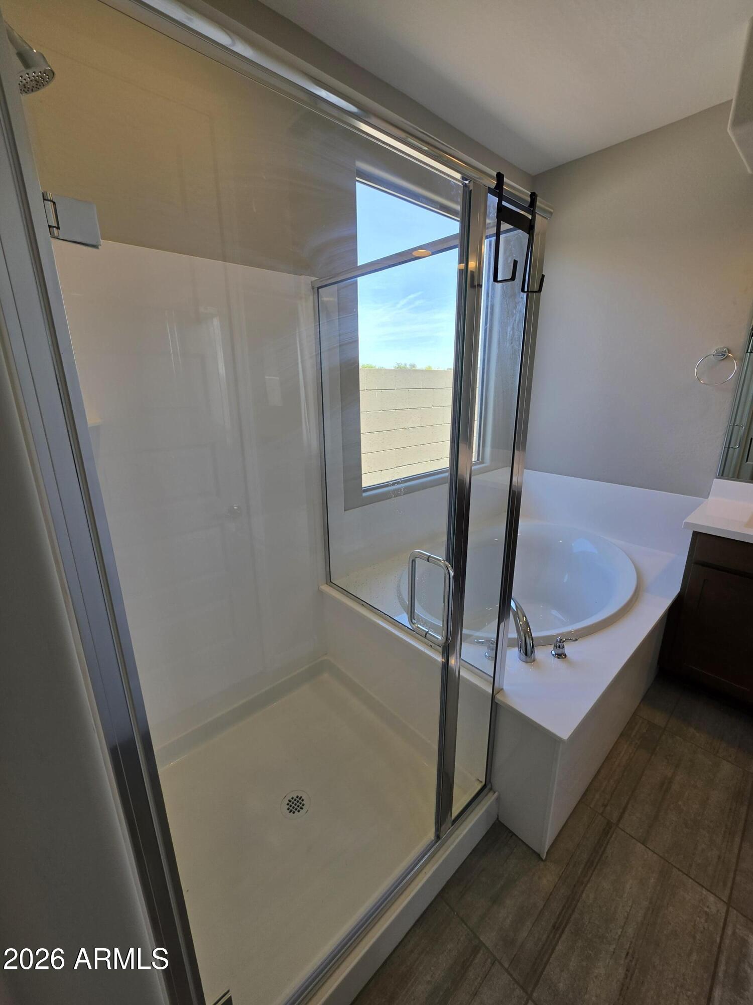 7128 West Coles Road Laveen, AZ 85339 - Photo 17 of 38 a bathroom with a tub and a shower