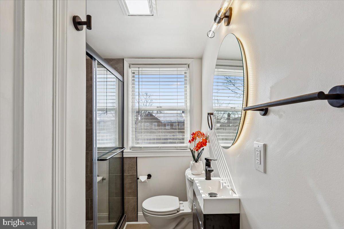 1616 Hardwick Road Towson, MD 21286 - Photo 16 of 36 a bathroom with a sink a toilet and shower