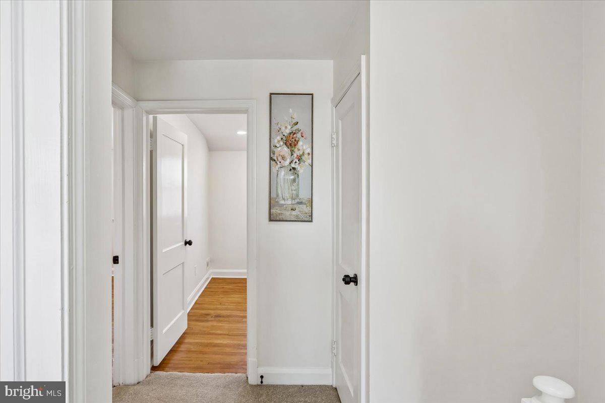 1616 Hardwick Road Towson, MD 21286 - Photo 18 of 36 a view of a hallway with wooden floor