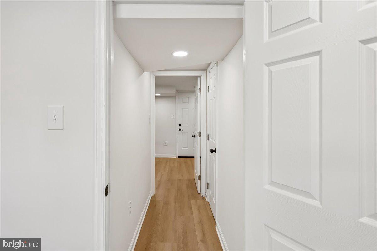 1616 Hardwick Road Towson, MD 21286 - Photo 29 of 36 a view of a hallway with wooden floor