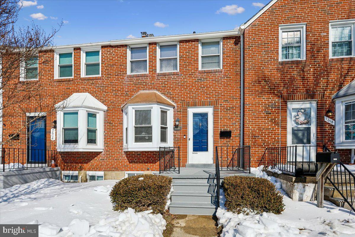 1616 Hardwick Road Towson, MD 21286 - Photo 3 of 36 a front view of a house with many windows