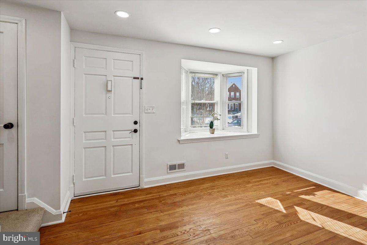 1616 Hardwick Road Towson, MD 21286 - Photo 6 of 36 a view of empty room with wooden floor and fan